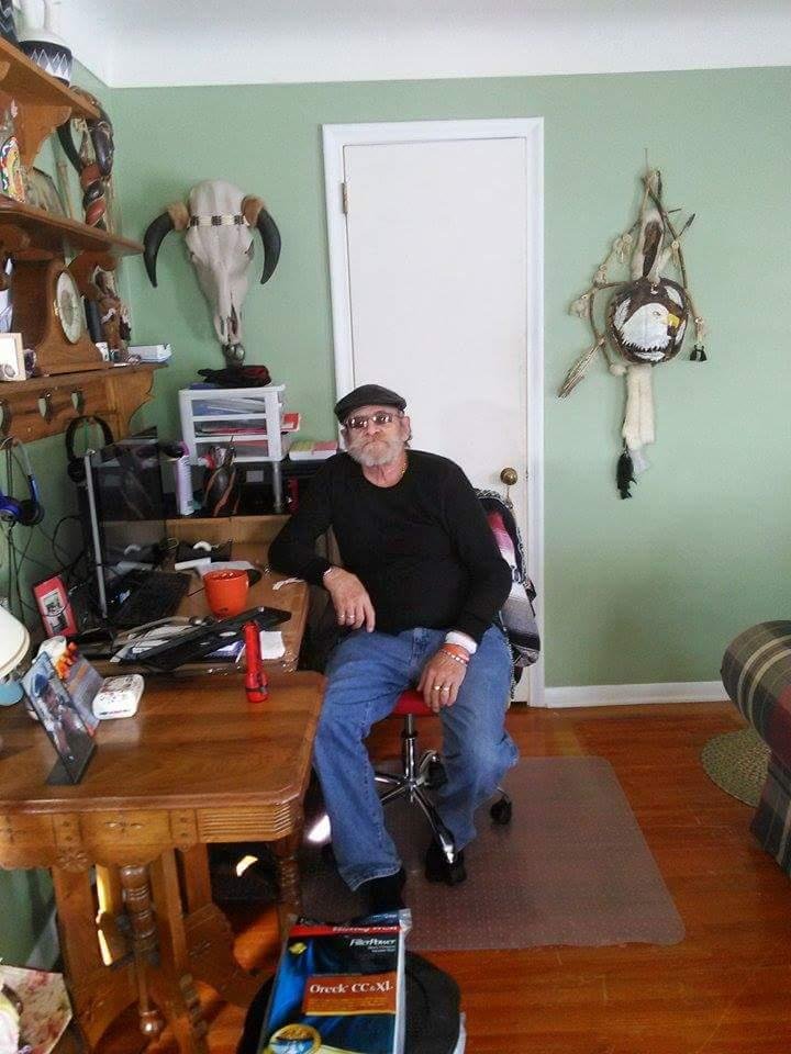 My husband Mike Murray. 2014 at his computer desk. His wonderful momentos of his life journey surrounding him. Love forever n ever my papa Mike.