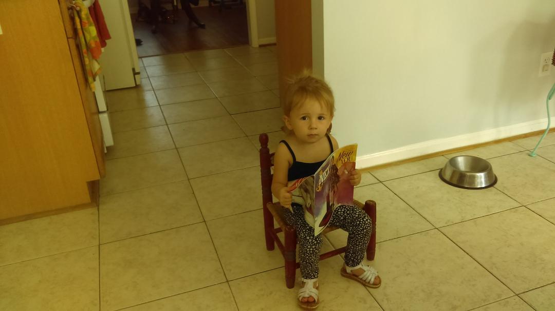 Everly reading her girly magazine.