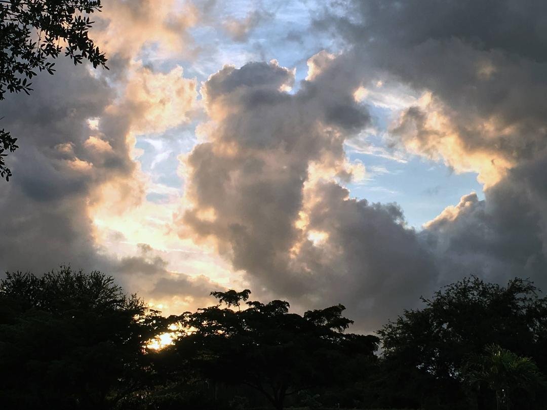 Interesting Opening in Clouds over SW Florida, Thursday. Some clouds don't have a "silver" lining, these have a "gold" lining.