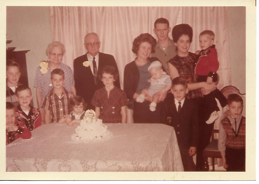This is my Mother and Father,  Clyde and Clara Floyd Redmond at their 50th Wedding Anniversary with the Grandchildren in 1964.