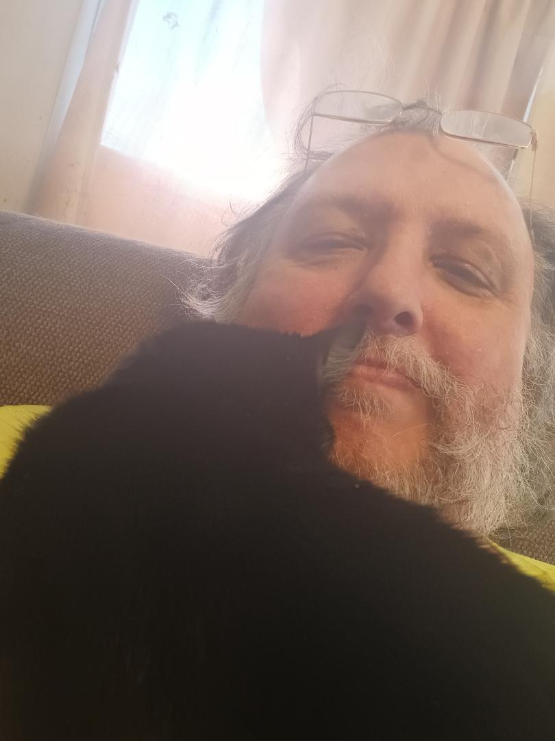 He's a contradiction. He thinks that he's the toughest cat in the house but he also wants to snuggle all the time.