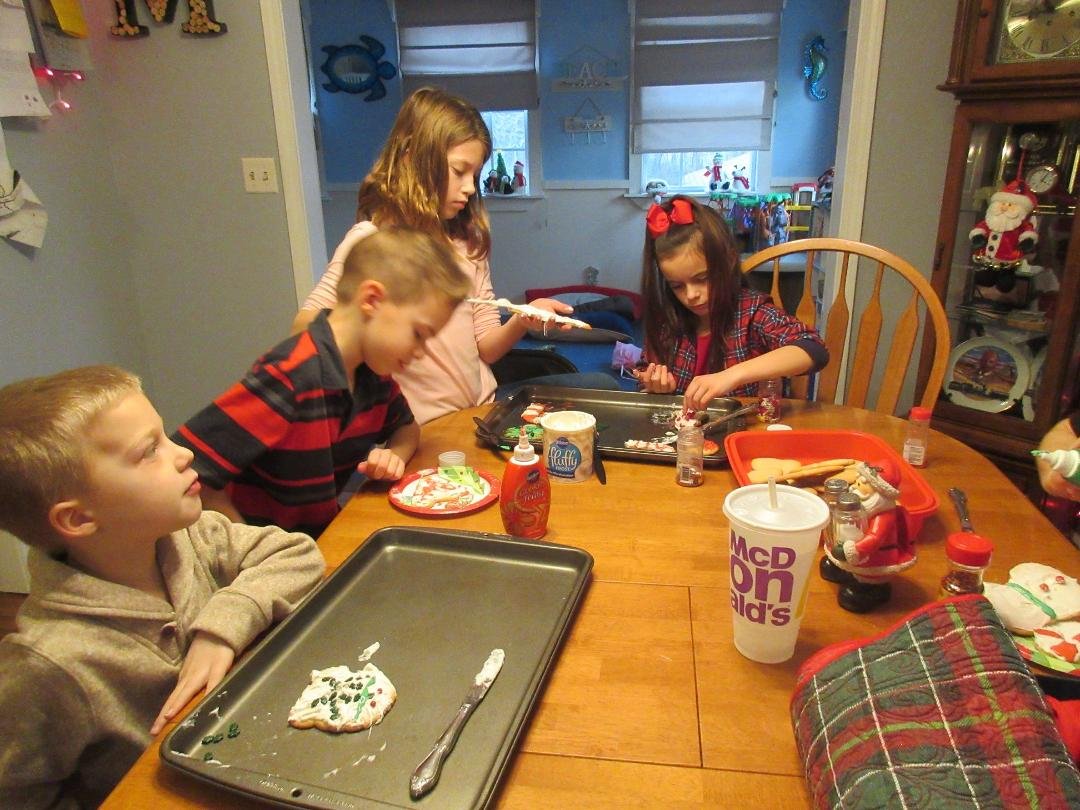 Kids decorating cookies for Santa