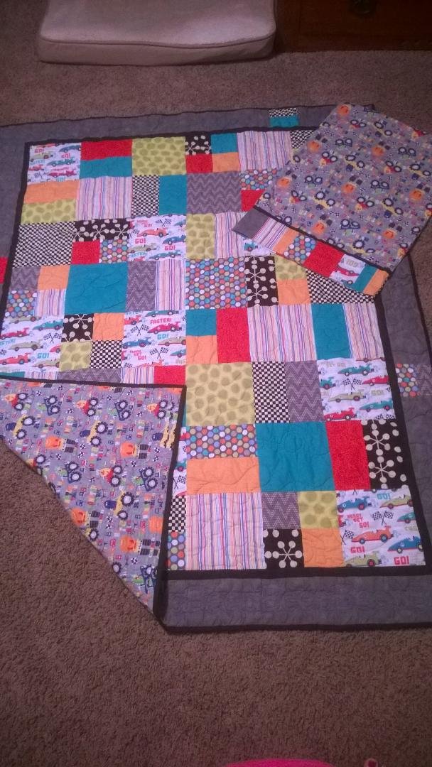 Just a fun quilt and pillowcase for my car and monster truck loving little guy.