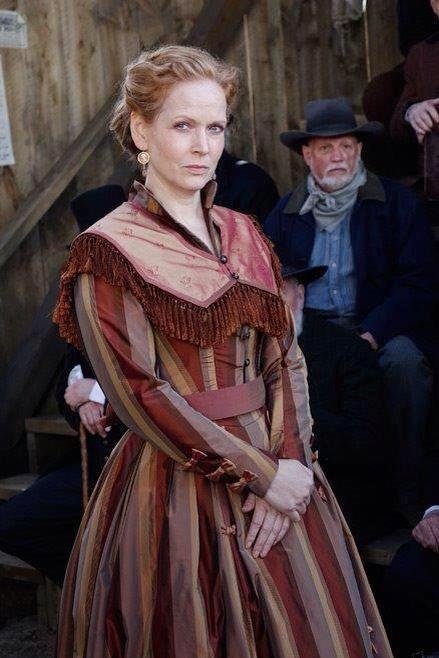 Who is that man in the background?