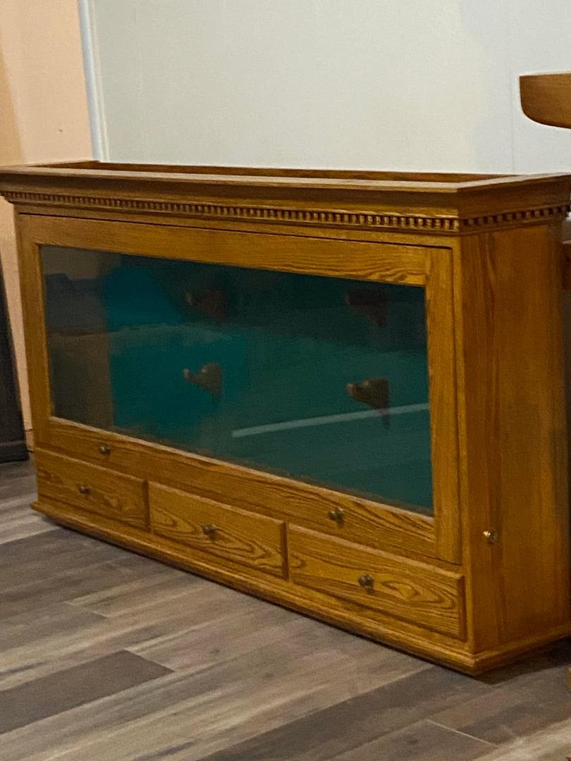 Gun cabinet. All wood. Hangs on wall. Make offer. Valued at 1200$ new. 334-790-3260