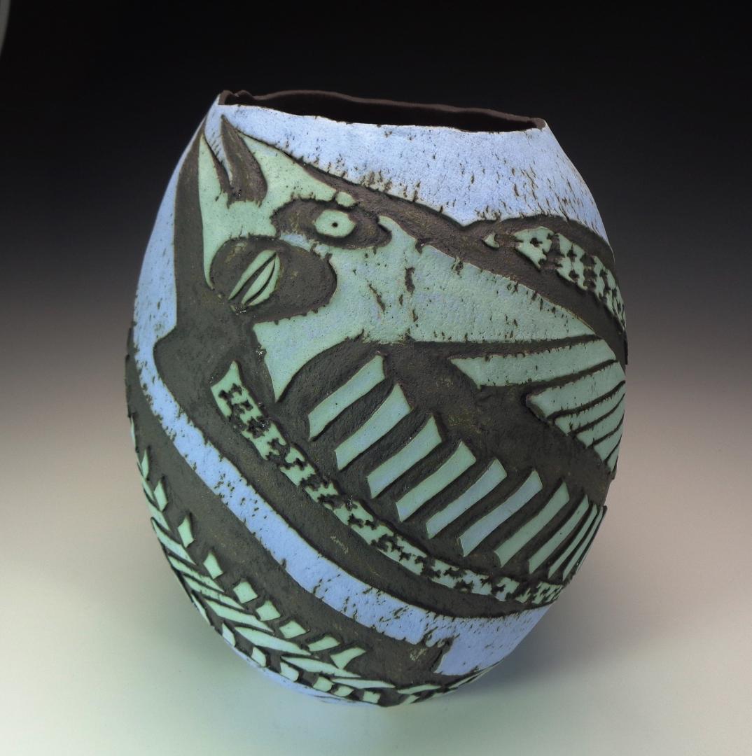 12" colored slips, black oxide stain fired to cone 2