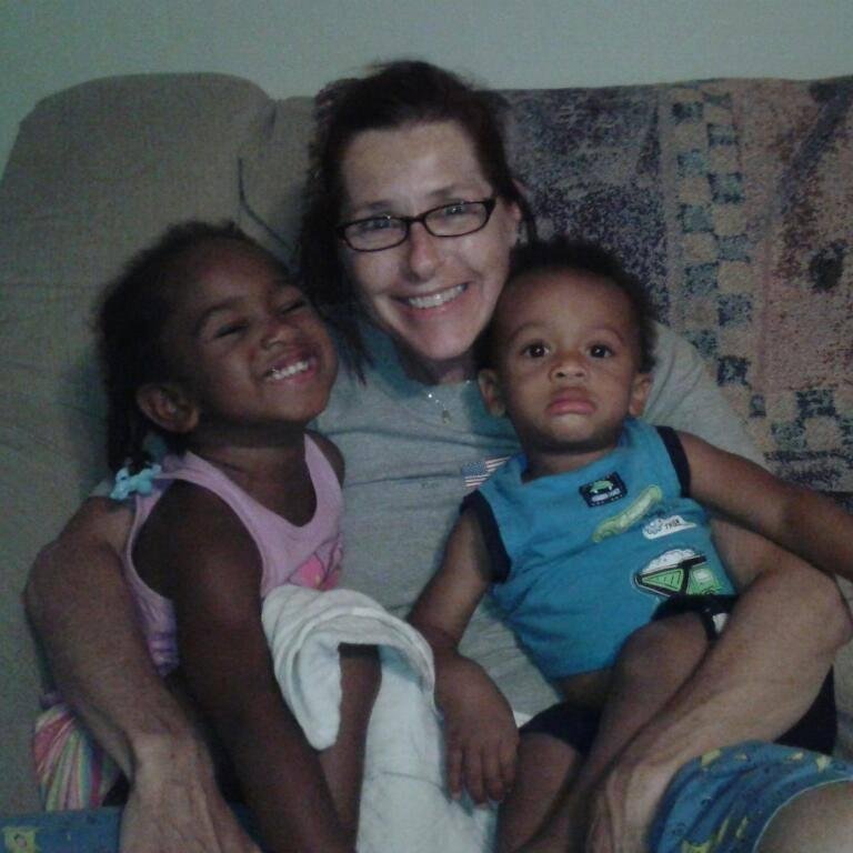 Olivia and Jarad help aunt Krista Kline-Schloo celebrate an early birthday.