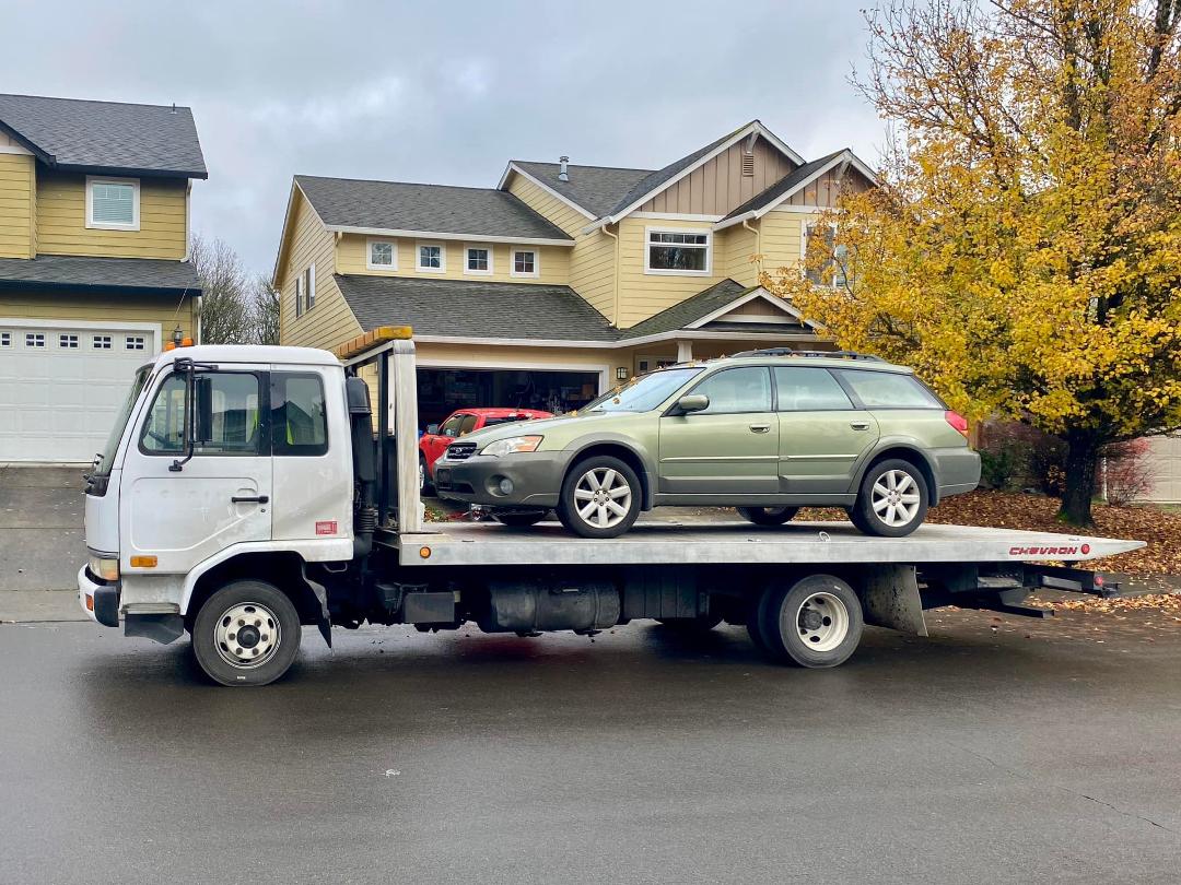 The transport to take the Outback arrives, and loads it up.