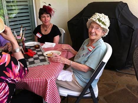 Mom enjoying our neighborhood Madhatter's Party.