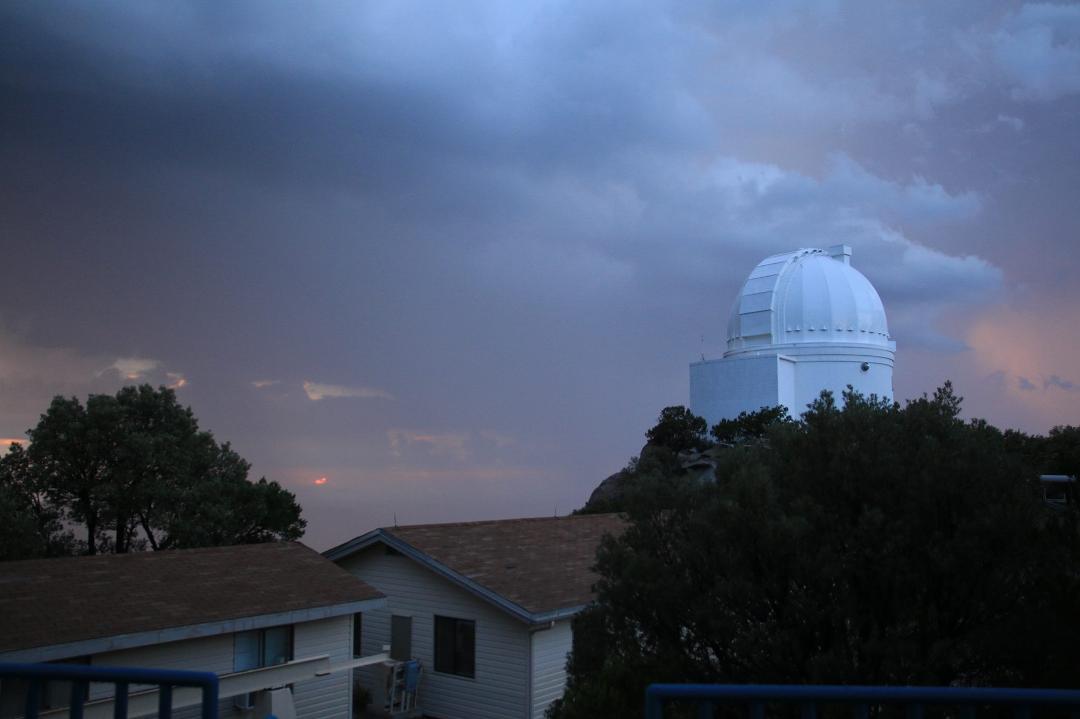 Yes, that is the Sun setting on the left next to the tree. And it was raining in the valley behind the dome.