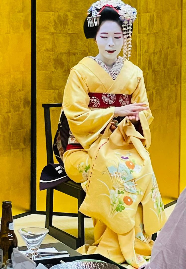 Geishas are NOT prostitutes; they are honored performers, we are told. Ours is 18yo, still in training. As such, she is allowed to put lipstick only on the lower lip. She lives in a boarding house with other trainees and mu