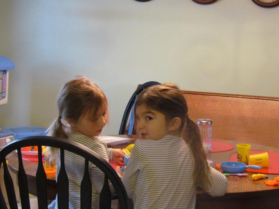 The girls love sitting at our dining room table to play with Play Doh.