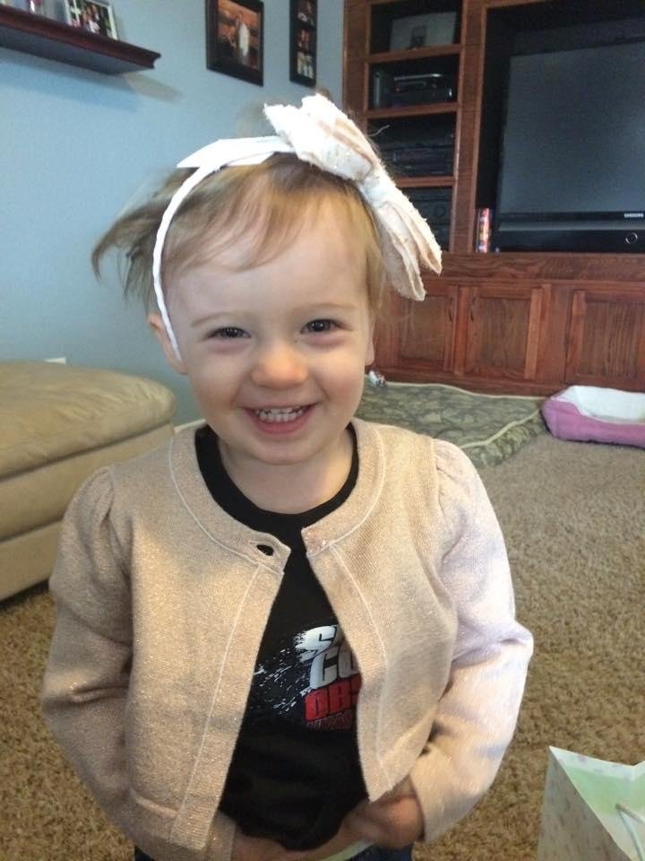 My granddaughter was so excited with her new Christmas outfit, she started putting everything on -- tags and all! I'm just crazy about this little girl. What a joy!