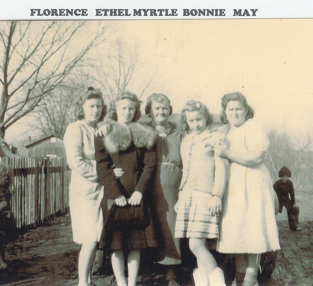 I've looked that this picture taken in the late 30s or early 40s of my Mom with her Mom and sisters maybe 50 time. I just now notice that kid in the back ground This may be the very first photo bomb every I have no idea wh