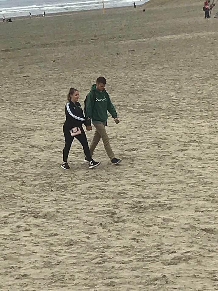 John & Jordyn walking on the beach it’s Seaside oregon.