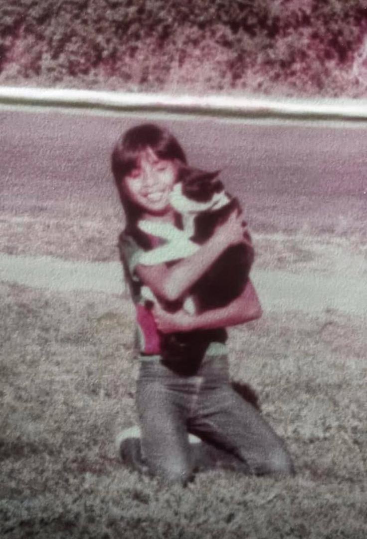My little sis and our cat Bea lol. At our front yard in our Santa Clara, CA house. They’re both so cute! I’m not sure how old she was here. I think she was 8.