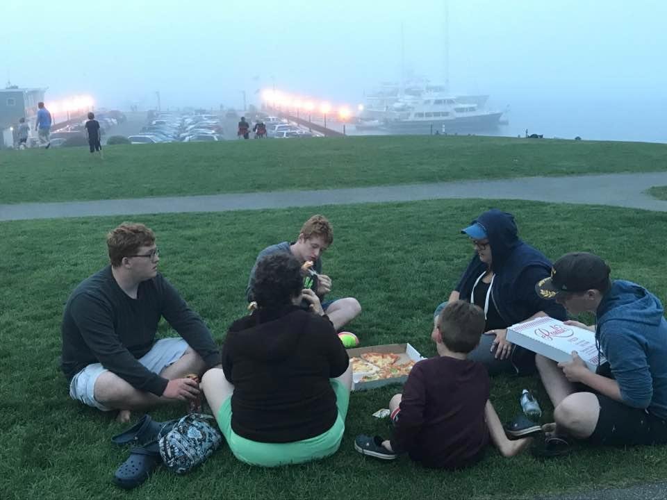 Eating pizza in the park watching the fog come in!