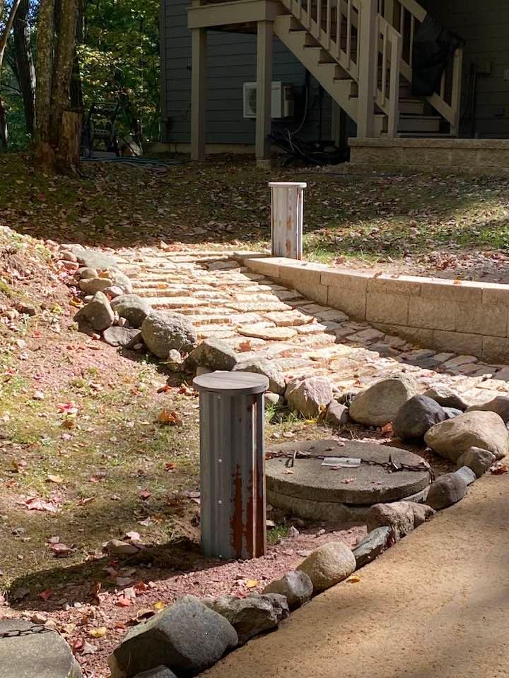 Clever covers for our septic pipes. Made by Duane Bliese. Thank you.