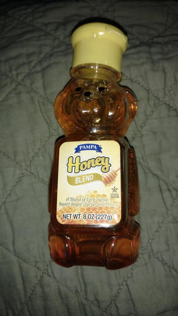 I stopped by Dollar Tree because they have Margaret Holmes okra and tomatoes. I grabbed this little bottle of honey because my jar of blueberry honey is crystalized and I need to boil it or something. I thought this honey '