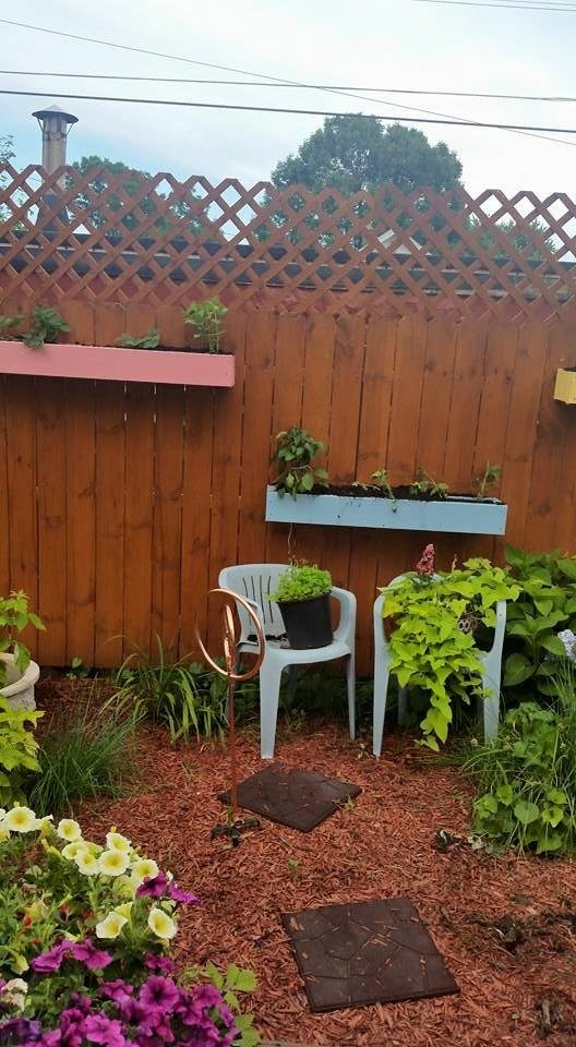 New flower boxes love them and now the morning glories are growing up and thru the fence.