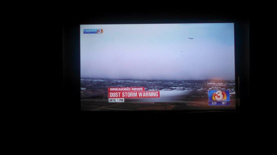 I took a picture of the television showing a wall of dust moving through the valley.
