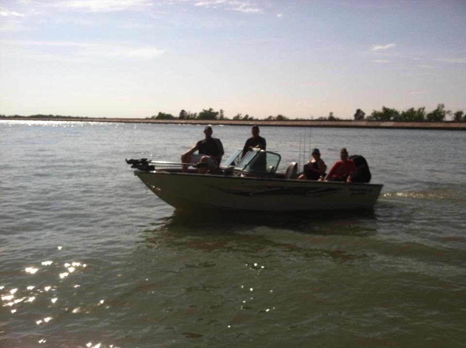 Brother Tim enjoying his new boat with his family. He was nice enough to give me a 5 min ride and kicked me out. Go figure.