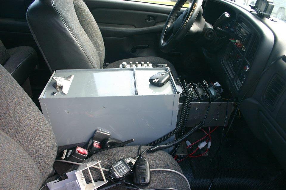 I removed the center seat and installed this box and 4 Amateur Radios and 1 CB radio on the box. The TS-B2000 remote head is on the Dash. I've added a mount for my laptop to interface with the TS-B2000 also.