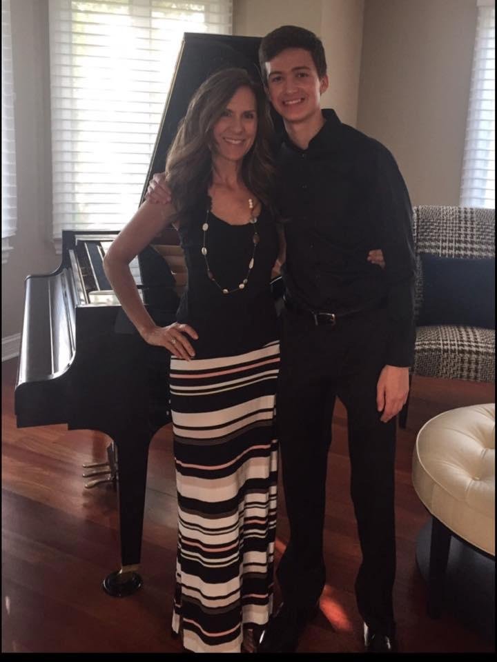 Karen getting Beau ready for Homecoming! They grow up too fast. My youngest grandchild.