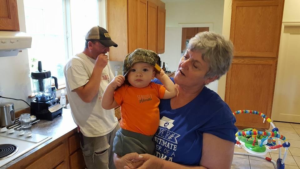 Gma and Quinn with Gpas hat. Son,Clayton,scarfing down some chicken,then back to the field.