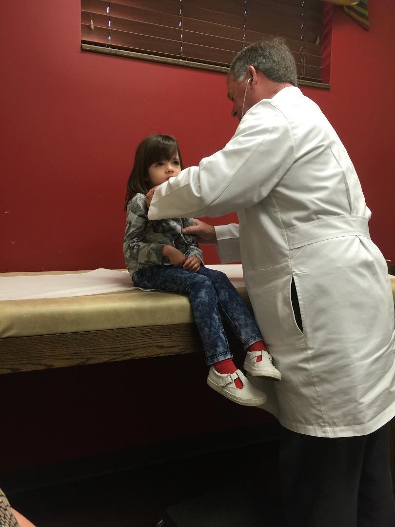 Katie at Children's clinic. Fever and bad cough