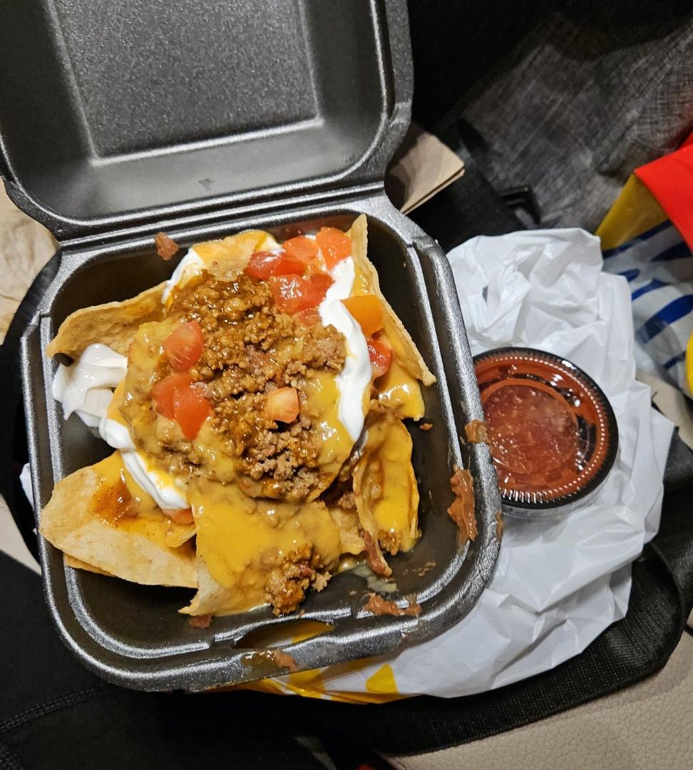 Taco Bueno 121st and Elm is the best here's the new smaller version of mucho nachos for only $3.49 yum yum yum