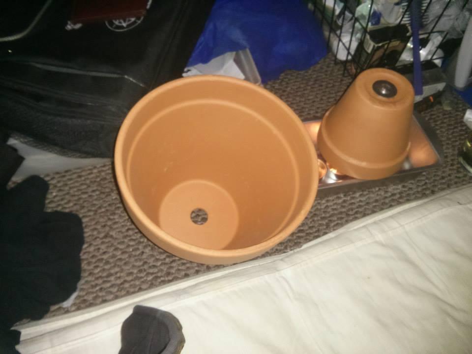 So the larger pot is at left and the two smaller pots that are bolted together are now over the candles.