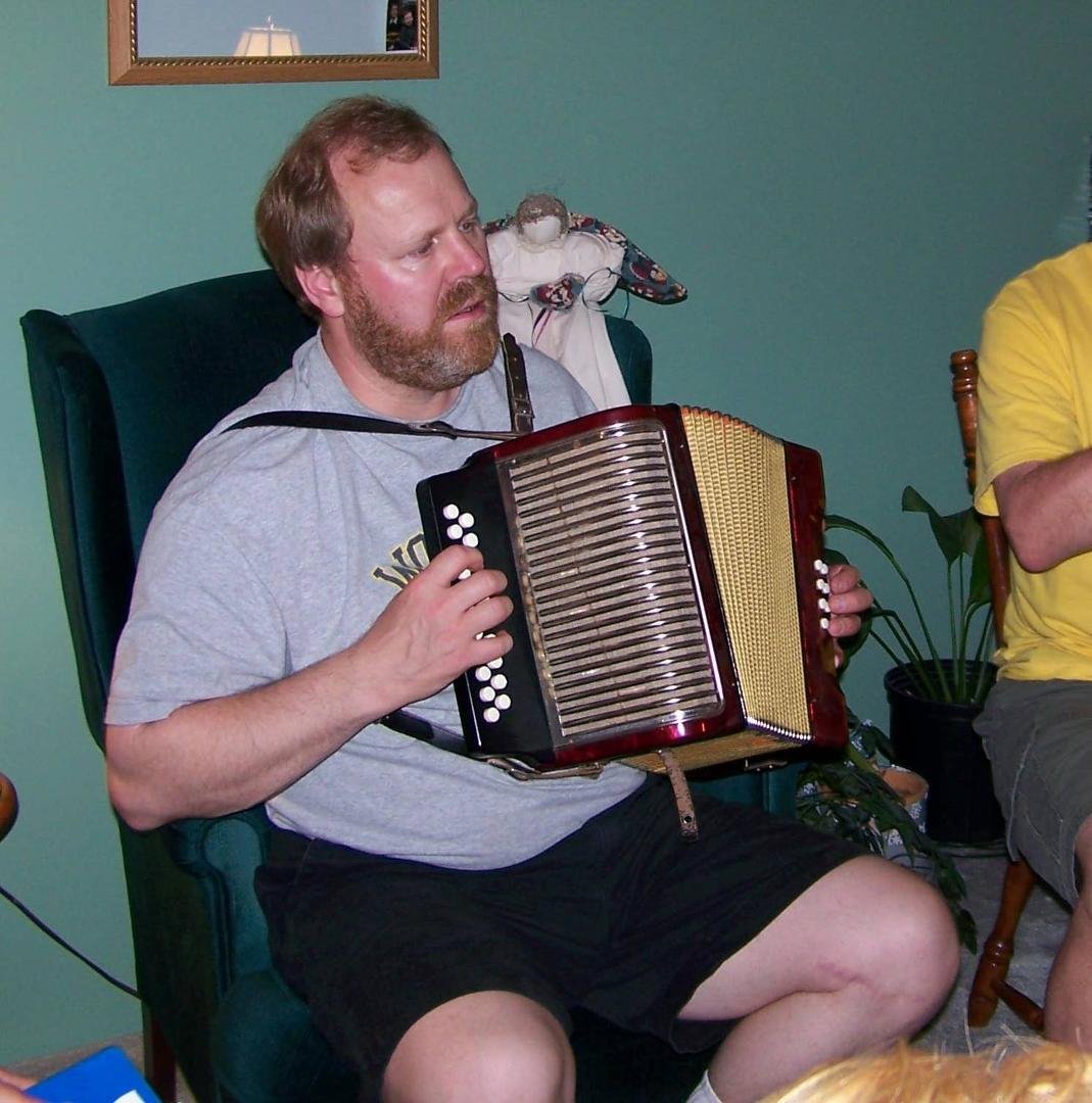 Playing a tune on the accordion.