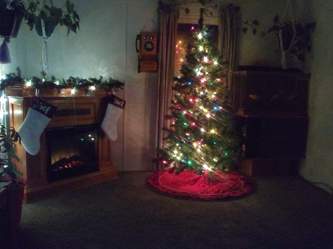 Loving our front room our tree 🎄 is up and the view of the cozy fireplace is awesome. :)