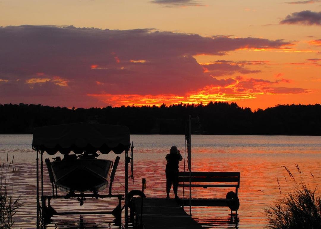 The photographer at work; colorful sunset on Butternut Lake this evening: