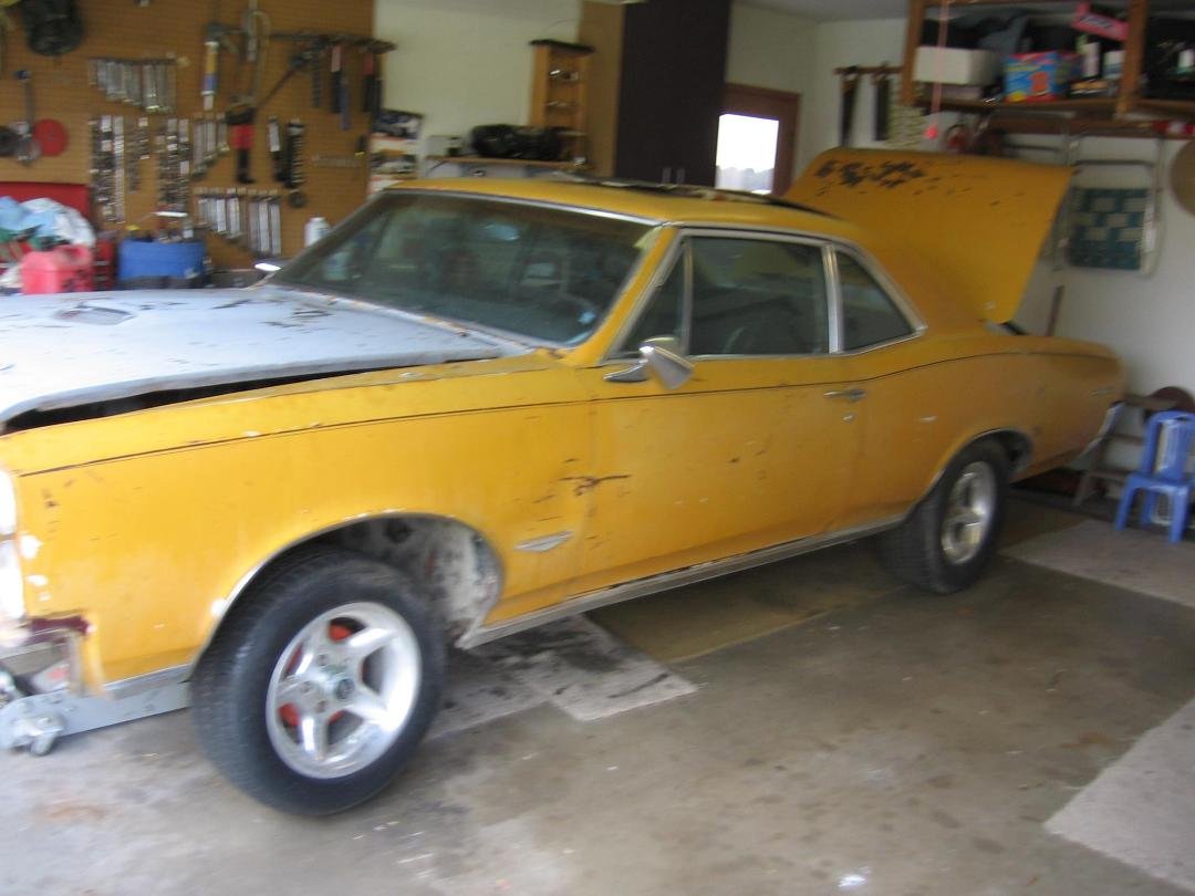 as Ricky Johnson is preparing the GTO for a new paint and new color this was the GTO when I purchased it and before restoration.