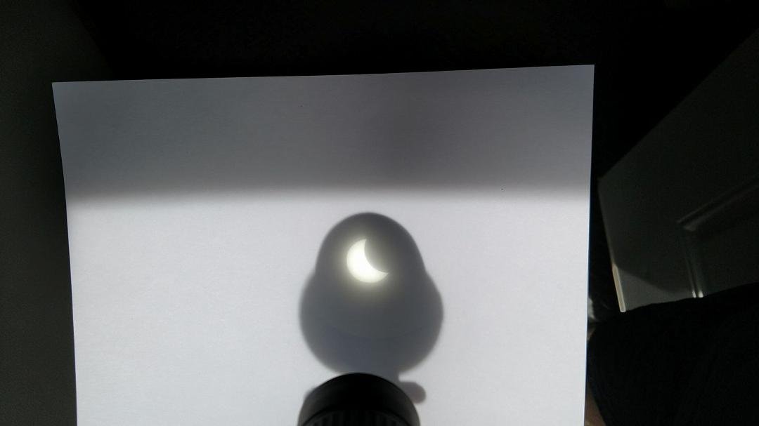 Eclipse projected on paper thru a spotting scope. From my driveway in East Haven.