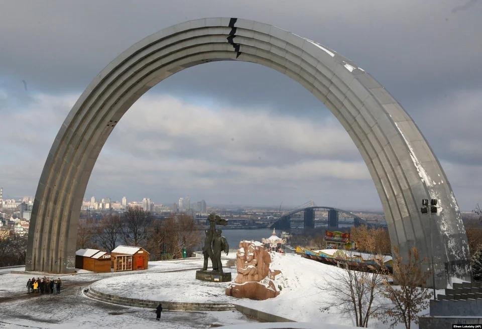 A crack made by Ukrainian artists on the arch of a Soviet-era monument to Ukrainian and Russian friendship seen in Kyiv.