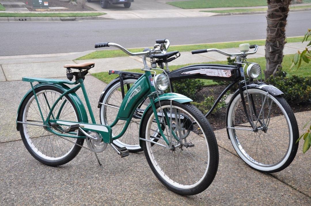 Green bike is a 1952. Black 1953. Both Hawthorne bikes made by the Cleveland welding company and sold by Montgomery Wards.