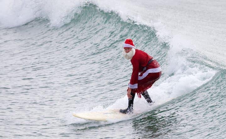 “The Old Man” as “Surfing Santa” for LA County Lifeguards, Christmas 1975 at Redondo Beach Breakwater…but I was not an “Old Man” back then…..the wool suit and boots were not “surfing friendly”…It was not until 1978, that LA