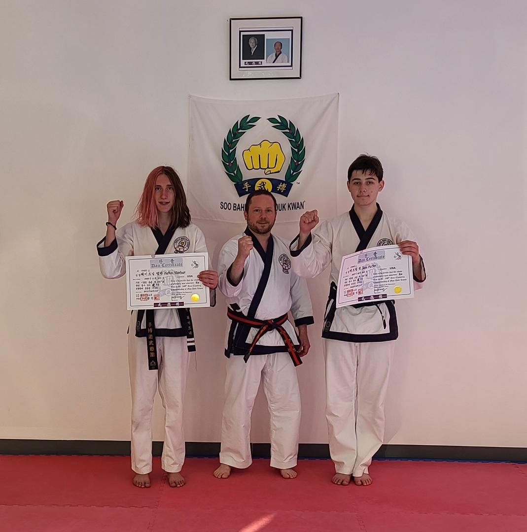 My son, Kellen, on the left receiving his Ee Dan (2nd degree) promotion. With his instructor, Master Jared Rosenthal, and buddy Sam. All fierce!