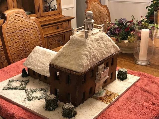 This is the gingerbread house I've been working on since August. Finally finished it the night before last after many mishaps like the roof caving in 3 times. Now, I have to transport it to Asheville, NC. Judging is Monday.