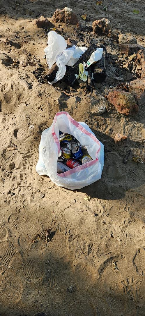 Picking up people's left overs. I aways carry trash bags on boat . Gets old though..