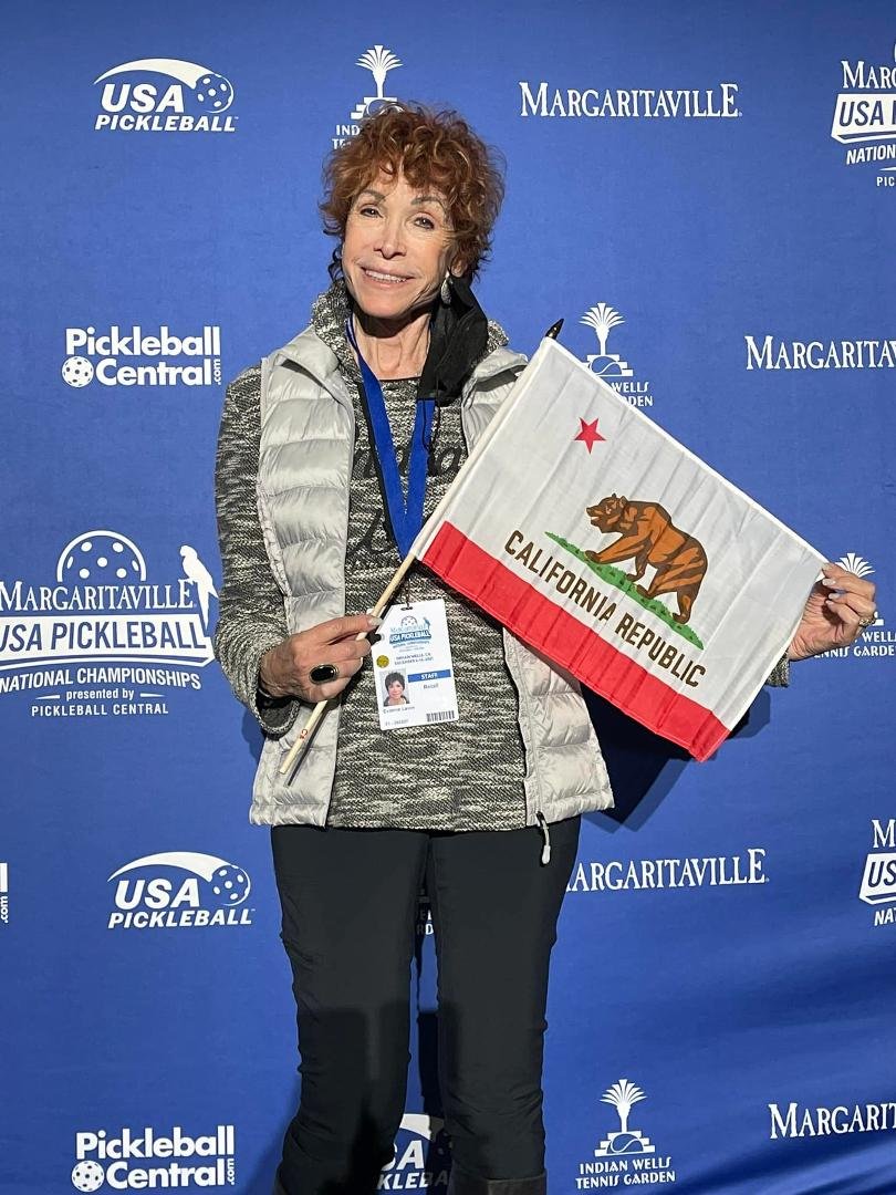 Taking a break from Helping out at the national pickle ball championships retail store￼ at The beautiful Indian Wells Tennis garden to represent our Golden State