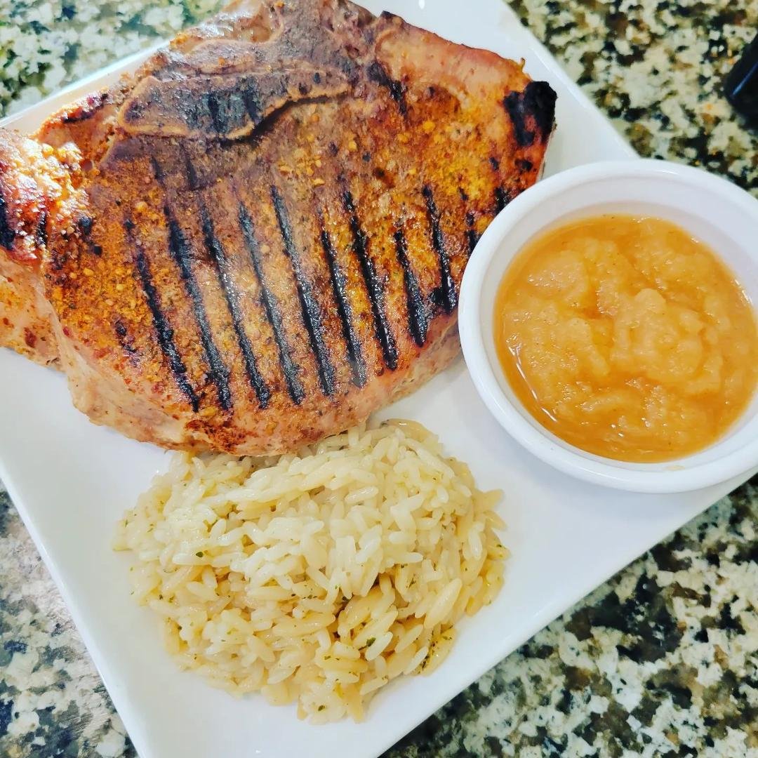 Grilled Porch Chop , rice pilaf and apple sauce. Were sharing the Chop just took a photo of it whole first #porchop #porkchoppsandapplesauce #porchopdinner #foodporn