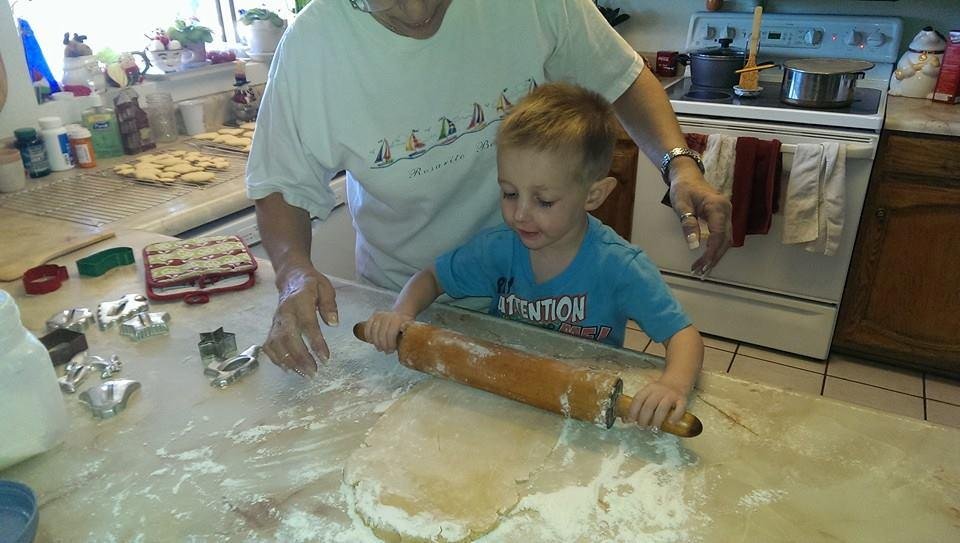 Dylan helping grandma.