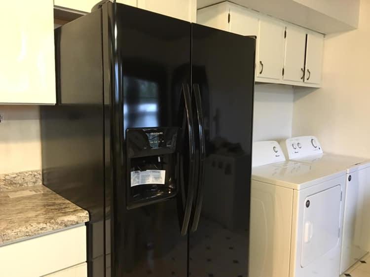 Baby steps. Today we installed the refrigerator. Eventually the washer and dryer will be enclosed behind louvered bifold doors, but that will be sometime in the future. All kitchen appliances are in place now but still need