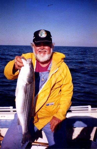 LANIER HOLDING A 28 INCH STRIPED BASS THAT HE CAUGHT NEAR OLD BOUY #46 IN THE CHESAPEAKE BAY IN ABOUT OCT 2000.