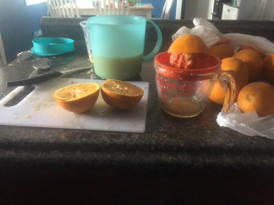 Making orange juice the old fashion way! Ezavier helped a little bit and then disappeared!