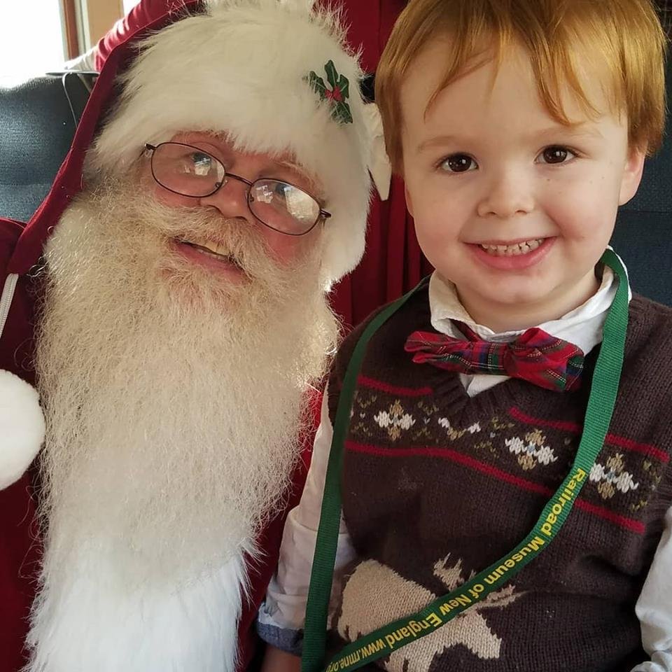 Nathanael with Santa on the Christmas Train.
